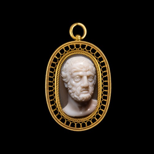 A Neoclassical gold pendant set with a large agate cameo. Bust of a philosopher.